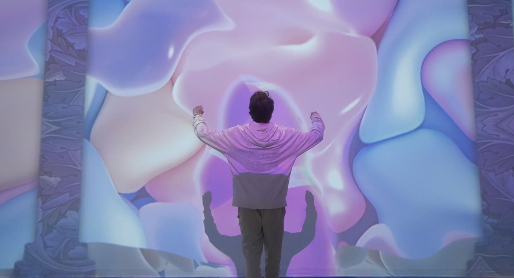 Visual portal on the wall, using people’s positions and height.