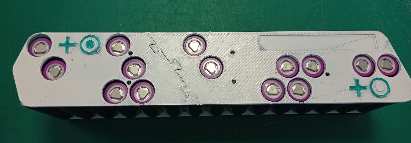 A poka-yoke, used to avoid inserting cells with the wrong polarity